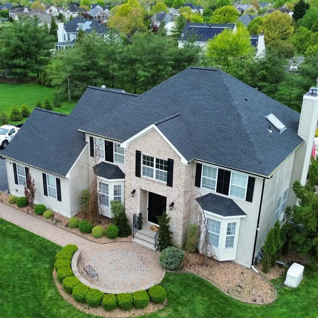Siding, bay windows and trim on a large two-story home